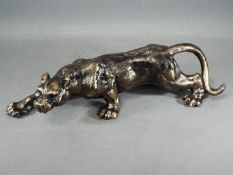 A cast iron lion figure.