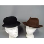 Two vintage hats comprising a Harrods of London bowler hat (approximately 59 cm internal
