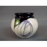 Moorcroft - a Moorcroft 'White Rose' vase, approximate height 5.