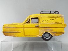A metal model of a Reliant Regal Supervan III in the style of the Only Fools and Horses van by