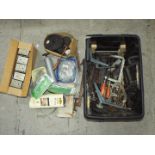 A large tub containing a quantity of clamps, hinges, a boxed corner cramp, tools, steel wool,