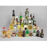A good mixed lot of approx 30 miniature collectables to include a ceramic Beneagles Scotch whisky