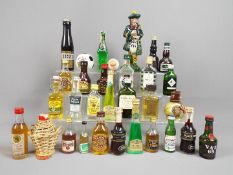 A good mixed lot of approx 30 miniature collectables to include a ceramic Beneagles Scotch whisky