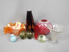 A quantity of glassware to include a Whitefriars style hexagonal section vase, art glass vases,