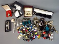 A quantity of costume jewellery, cameo brooch and wristwatches to include Citron, Zeon and similar.