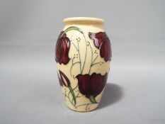 Moorcroft - a Moorcroft vase in the Chocolate Cosmos pattern, approximate height 10.