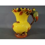 An Art deco Wadeheath jug with parrot handle, approximately 21 cm (h).
