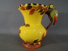 An Art deco Wadeheath jug with parrot handle, approximately 21 cm (h).