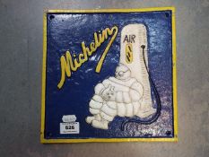 A cast iron Michelin sign,