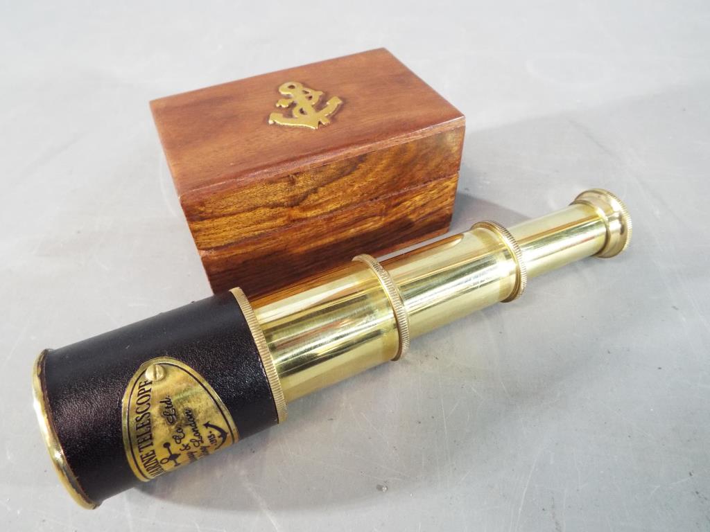 A cased brass marine telescope