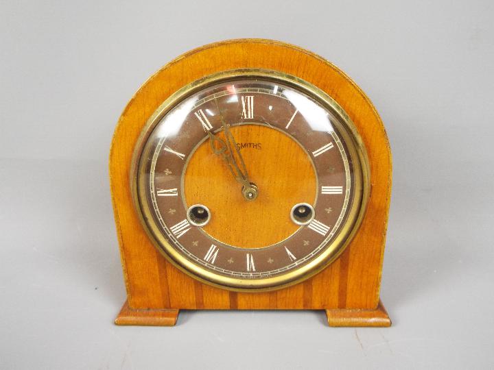 A small Smiths wood cased mantel clock w