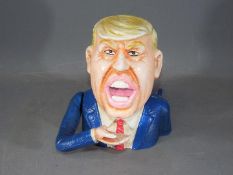 A cast money bank of Donald Trump (xbtrt