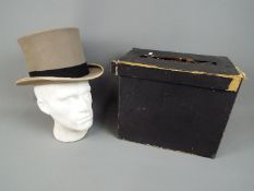 A boxed Bates of London top hat (approxi