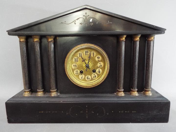 A continental mantel clock of architectu