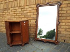 A good quality oak framed wall mirror 67 cm x 108 cm and a hexagonal 1920's drinks cabinets,