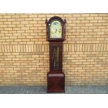 A contemporary dark wood cased grandmother clock with Westminster chiming weight driven movement