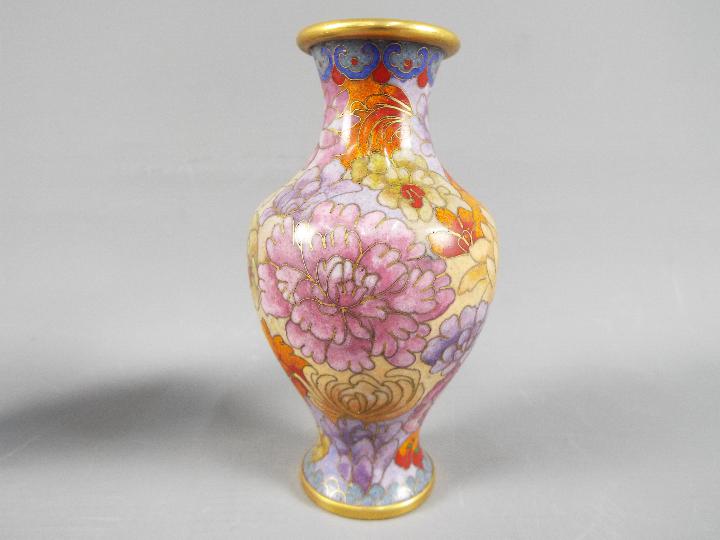 A small pair of Chinese cloisonné vases decorated with chrysanthemum, ruyi head band to the rim, - Image 2 of 2