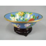 A Chinese cloisonné footed bowl decorated to the interior and exterior with flowers and butterflies