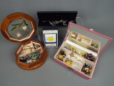 Two jewellery boxes containing a quantity of costume jewellery.