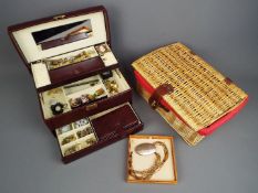 A jewellery box containing a quantity of costume jewellery, a pair of 9ct yellow gold earrings (1.