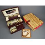 A jewellery box containing a quantity of costume jewellery, a pair of 9ct yellow gold earrings (1.