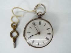 A lady’s silver cased pocket watch, case having engraved floral decoration,