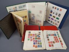 Philately - a world stamp collection contained in six albums to include French colonies and other