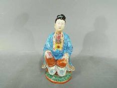 A rare 18th century, Chinese, famille rose figurine depicting a scholar or possibly Guanyin,