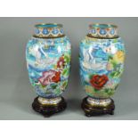 A pair of Chinese cloisonné vases with depictions of swimming swans set amongst flowering plants,