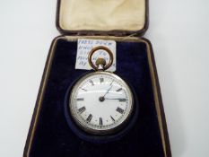 A lady’s silver cased pocket watch, case having engraved decoration,