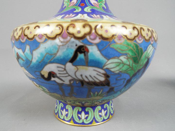 A pair of Chinese cloisonné vases decorated to the body with Red Crowned Cranes in a landscape - Image 3 of 4