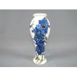 Moorcroft - A Moorcroft Pottery vase decorated in the 'Delphinium' pattern,