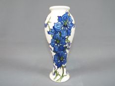 Moorcroft - A Moorcroft Pottery vase decorated in the 'Delphinium' pattern,