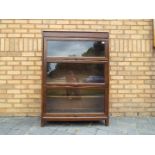 A Gunn three tier sectional bookcase, approximately 123 cm x 87 cm x 31 cm.