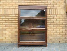 A Gunn three tier sectional bookcase, approximately 123 cm x 87 cm x 31 cm.