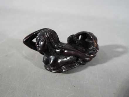 A vintage Japanese dark wood Netsuke depicting an Owl seated on a thick branch or log, - Image 3 of 5