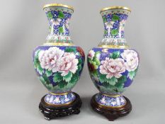 A large pair of Chinese cloisonné vases decorated with flowers and butterlfy to the body with