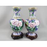 A large pair of Chinese cloisonné vases decorated with flowers and butterlfy to the body with