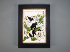 Moorcroft - A Moorcroft Pottery 'Daisy the Cat' wall plaque, approximately 20 cm x 27 cm.
