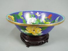 A Chinese cloisonné enamel bowl decorated to the interior and exterior with flowers and butterflies