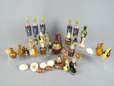 A collection of various alcoholic drinks to include honey wine, whisky, Benedictine and other.