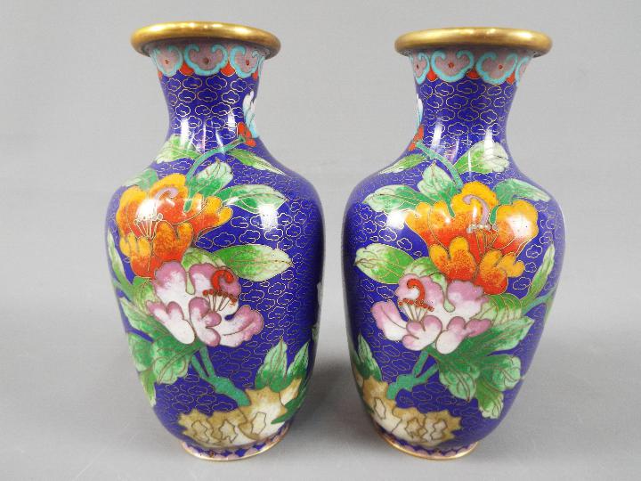 A small pair of Chinese cloisonné vases decorated with flowers and butterfly against a blue ground, - Image 2 of 2