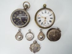 A good mixed lot to include two gentleman’s pocket watches together with four silver watch fobs and