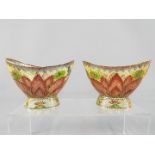 A pair of modern plique-a-jour bowls depicting stylised flowers and butterflies,