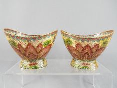 A pair of modern plique-a-jour bowls depicting stylised flowers and butterflies,