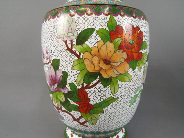 A pair of Chinese cloisonné vases decorated with flowers, birds and insects on a white ground, - Image 3 of 3