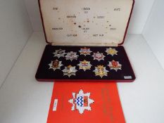 London Fire Brigade Historic Badges - a cased set of ten badges issued in a limited edition with