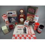A collection of advertising tins, Coca Cola branded napkin dispensers, toothpick dispensers,