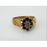 A hallmarked 9ct gold cluster ring, size O 1/2, approximately 3.14 grams all in.