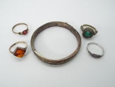 A small collection of jewellery to include silver hallmarked bangle, stone set ring stamped .